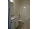 Clean bathroom with a bathtub, toilet, and vanity at 3025 Ballad Rd, Kissimmee, FL 34746