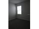 Bright bedroom with neutral walls and carpet flooring at 3025 Ballad Rd, Kissimmee, FL 34746