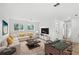 Spacious Gathering room with L-shaped sofa and foosball table at 634 Burch Ave, Winter Garden, FL 34787