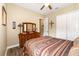 Guest bedroom with queen-size bed and ample closet space at 25822 Feather Ridge Ln, Sorrento, FL 32776