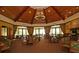 Spacious clubhouse dining area with high ceilings and large windows at 25822 Feather Ridge Ln, Sorrento, FL 32776