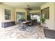Covered patio with seating area and a ceiling fan at 25822 Feather Ridge Ln, Sorrento, FL 32776