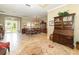 Dining room with wooden table and chairs and view to entry way at 25822 Feather Ridge Ln, Sorrento, FL 32776