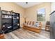 Office space with a futon, bookshelf, and TV at 25822 Feather Ridge Ln, Sorrento, FL 32776