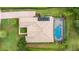 An elevated view showcasing a single Gathering home with a pool and lush landscaping at 25822 Feather Ridge Ln, Sorrento, FL 32776