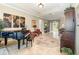 Living room with piano, ornate rug, and view to dining room at 25822 Feather Ridge Ln, Sorrento, FL 32776