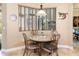 Charming breakfast nook with a round table and wrought iron chairs at 25822 Feather Ridge Ln, Sorrento, FL 32776