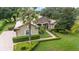 One-story home with pool and lush landscaping at 25822 Feather Ridge Ln, Sorrento, FL 32776