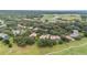 Aerial view of upscale homes and a golf course community at 25822 Feather Ridge Ln, Sorrento, FL 32776