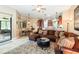 Spacious Gathering room with sectional sofa and access to the backyard at 25822 Feather Ridge Ln, Sorrento, FL 32776