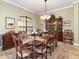 Elegant dining room featuring a large table and traditional furnishings at 25822 Feather Ridge Ln, Sorrento, FL 32776