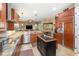 Gourmet kitchen featuring granite countertops and stainless steel appliances at 25822 Feather Ridge Ln, Sorrento, FL 32776