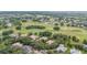 Aerial view showcasing the community's location near a golf course at 25822 Feather Ridge Ln, Sorrento, FL 32776