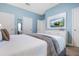 Main bedroom with a comfortable bed and a built-in media console at 740 Pebble Beach Dr, Davenport, FL 33896