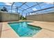 Relax and cool off in this refreshing screened pool oasis at 740 Pebble Beach Dr, Davenport, FL 33896