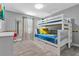 Bedroom with bunk beds and a TV at 740 Pebble Beach Dr, Davenport, FL 33896