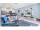Open concept kitchen and living area with modern appliances and a stylish design at 740 Pebble Beach Dr, Davenport, FL 33896