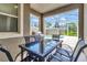 Patio with table, chairs, and grill at 740 Pebble Beach Dr, Davenport, FL 33896