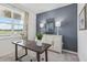 Home office with window, desk, and stylish decor at 12965 Trovita Dr, Grand Island, FL 32735