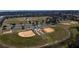 Aerial view of multiple baseball fields and parking lot at 12965 Trovita Dr, Grand Island, FL 32735