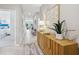 Bright entryway with wood console table and rug at 12965 Trovita Dr, Grand Island, FL 32735