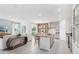 Open concept kitchen with island and view of living room at 12965 Trovita Dr, Grand Island, FL 32735