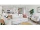 Living room with sectional sofa and view of kitchen at 12965 Trovita Dr, Grand Island, FL 32735