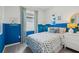 Bedroom with blue walls and turtle themed bedding at 12965 Trovita Dr, Grand Island, FL 32735