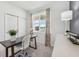 Bright bedroom with window and built-in workspace at 12965 Trovita Dr, Grand Island, FL 32735