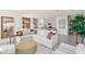 Open concept living room with sectional sofa and kitchen view at 12965 Trovita Dr, Grand Island, FL 32735