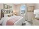 Light bedroom with a neutral color scheme at 12965 Trovita Dr, Grand Island, FL 32735