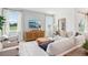 Light and airy living room with large windows and sectional sofa at 12965 Trovita Dr, Grand Island, FL 32735