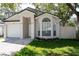 Cute one-story house with a white garage door at 997 Hamlet Ct, Maitland, FL 32751