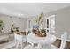 Bright dining area with white table and chairs near living room at 2804 Gulfstream Rd, Orlando, FL 32805