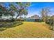 Large backyard with green grass and home view at 2811 Vine St, Orlando, FL 32806