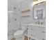 Modern bathroom with white vanity, glass shower, and floating shelves at 2811 Vine St, Orlando, FL 32806