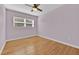 Simple bedroom with hardwood floors and light purple walls at 2811 Vine St, Orlando, FL 32806