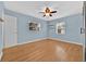 Bedroom with light blue walls, wood floors and ceiling fan at 2811 Vine St, Orlando, FL 32806