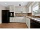 Well-equipped kitchen featuring granite countertops and white cabinetry at 2811 Vine St, Orlando, FL 32806