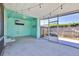 Large screened porch with TV and string lights at 2811 Vine St, Orlando, FL 32806