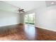 Living room with wood floors and sliding glass doors at 200 Saint Andrews Blvd # 1402, Winter Park, FL 32792