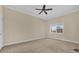 Large bedroom with plush carpet, ceiling fan and window at 7650 Whisper Way # 301, Reunion, FL 34747