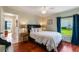 Bedroom with wood floors and a view of the backyard at 14310 Lord Barclay Dr, Orlando, FL 32837