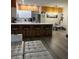 Modern kitchen with stainless steel appliances and island at 3384 Corona Village Way # 108, Orlando, FL 32835