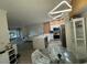 Modern kitchen with white cabinets, stainless steel appliances, and an island at 3384 Corona Village Way # 108, Orlando, FL 32835