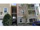 Three-story condo building with parking and trees at 3384 Corona Village Way # 108, Orlando, FL 32835
