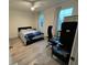 Bedroom with a queen-size bed, office space, and window coverings at 3384 Corona Village Way # 108, Orlando, FL 32835