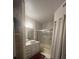 Clean bathroom with a tub, shower, and updated vanity at 3384 Corona Village Way # 108, Orlando, FL 32835