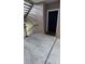Building interior showing unit entrance with doormat at 3384 Corona Village Way # 108, Orlando, FL 32835