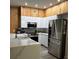 Modern kitchen with stainless steel appliances and island at 3384 Corona Village Way # 108, Orlando, FL 32835